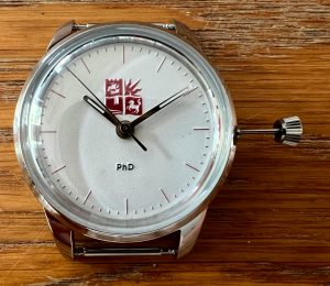 Cased watch movement with too long of a stem.
