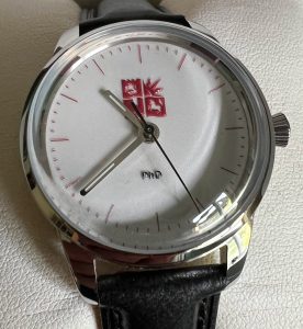 Complete watch on a cushion